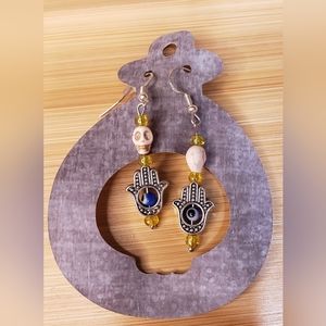 Evil eye and skull earrings